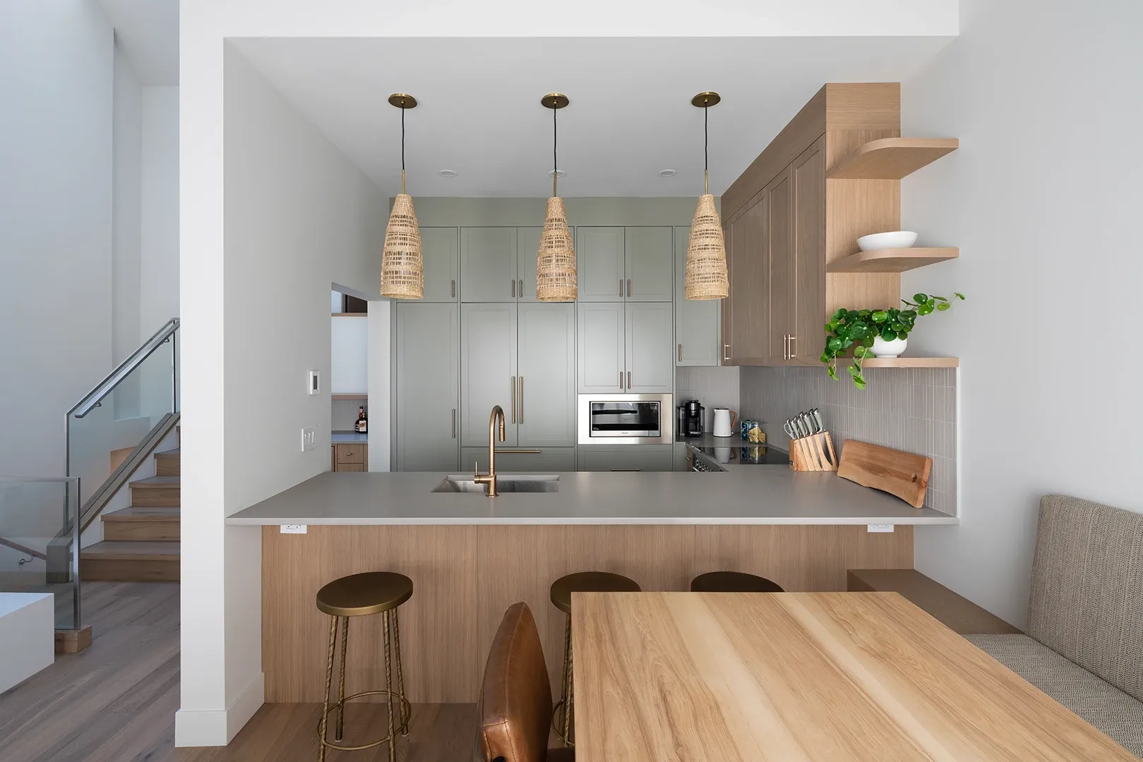 Whistler townhome kitchen with floor to ceiling cabinetry and a wrap-around island