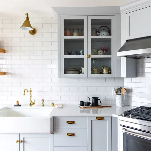 Light Grey Kitchen Cabinets with white tile backsplash